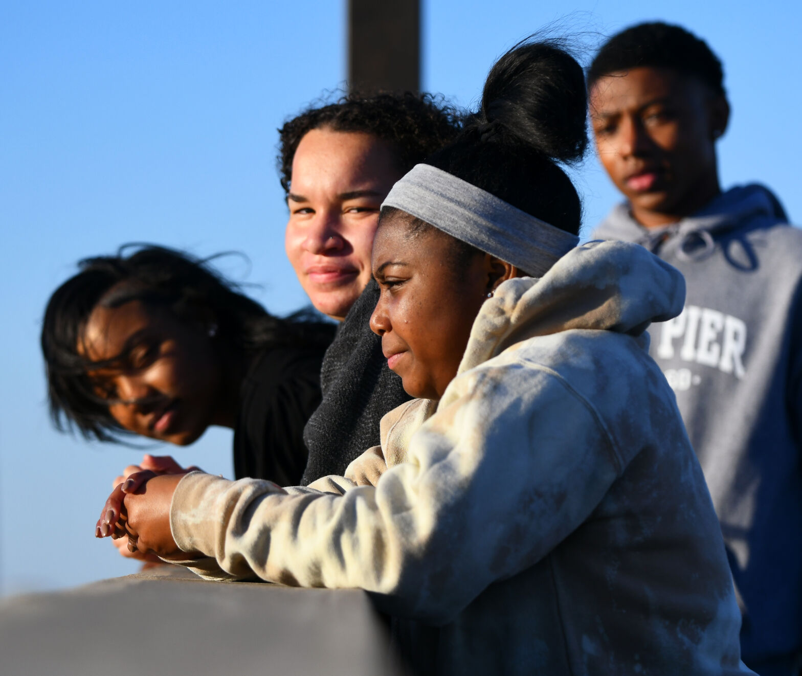 Taylor Iverson, front, stands at the edge of the rail along with friends Jaeden Cunningham, left, Makayla Hill, second from left, and Elijah Hudson-Moore, right